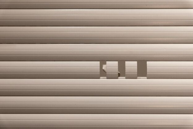 Abstract minimalist design featuring geometric lines and shapes in a neutral color palette.